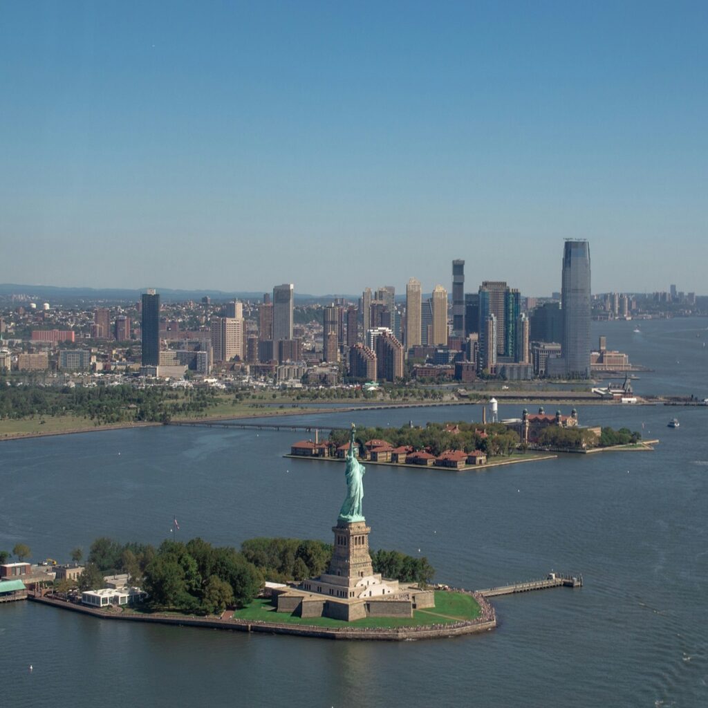 Statue of Liberty with New York City skyline, one of the best places to visit in the USA